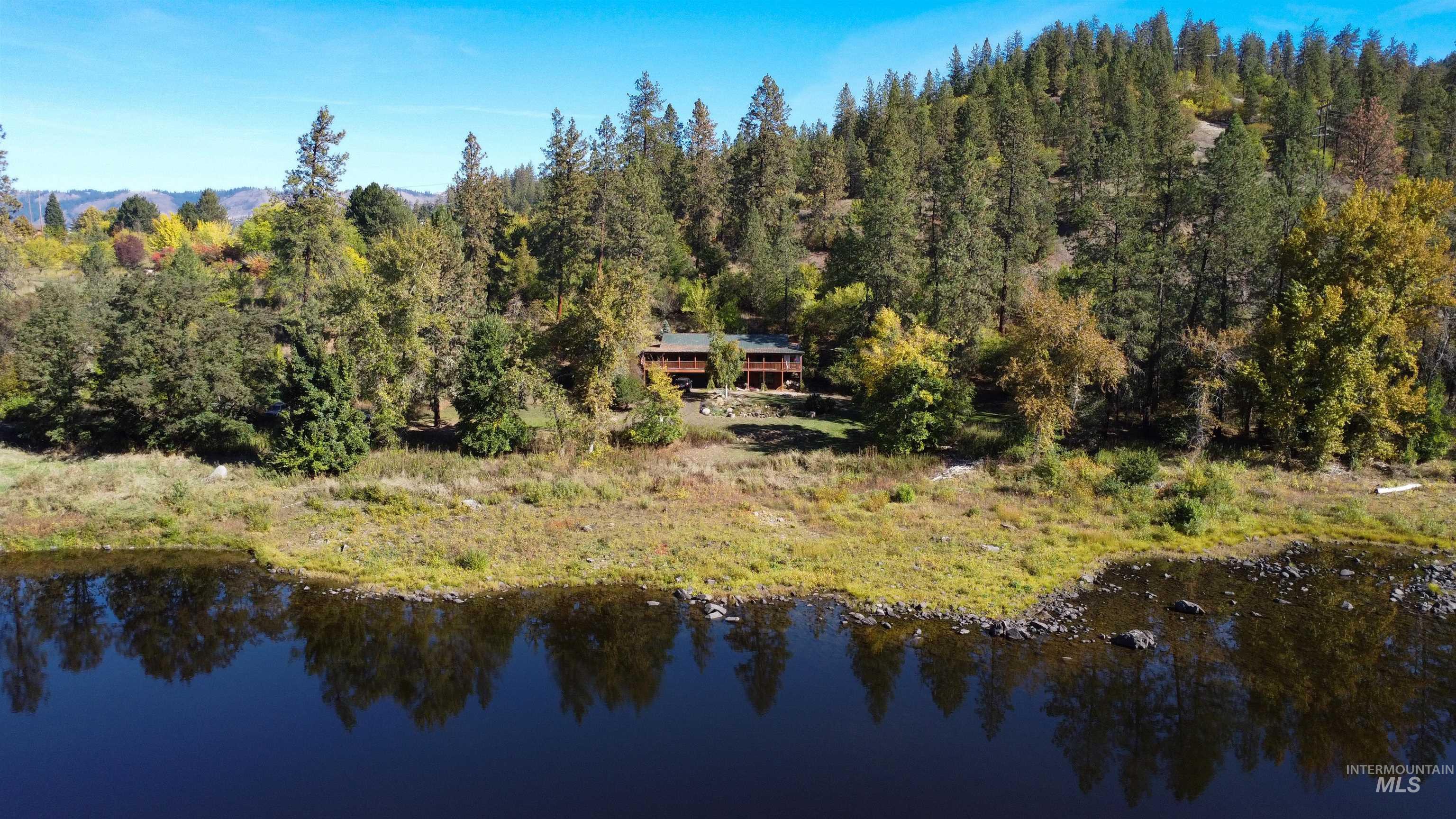 4480 Highway 12 Kamiah, ID 83536 - Photo 3 of 49 View from above of property featuring a large body of water and a forest