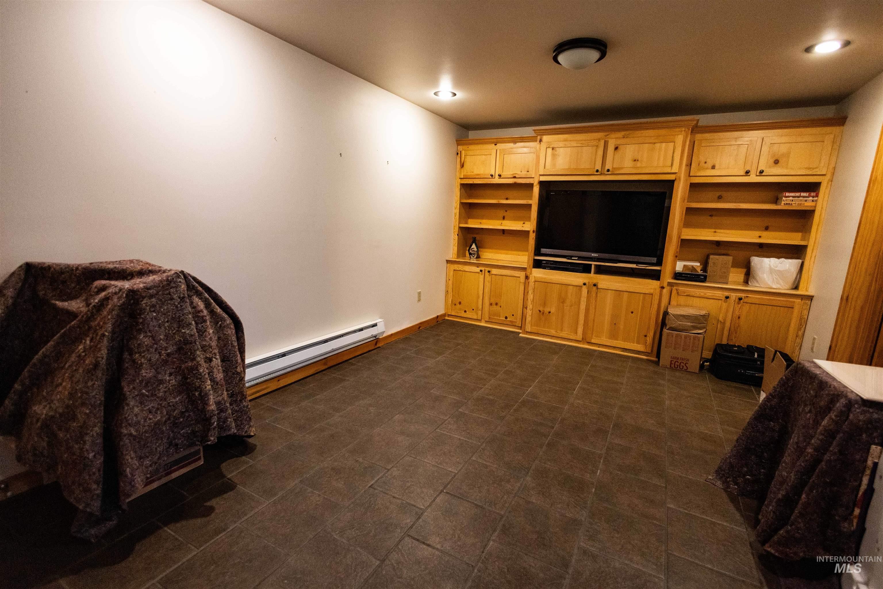 4480 Highway 12 Kamiah, ID 83536 - Photo 38 of 49 Living area featuring a baseboard heating unit and recessed lighting