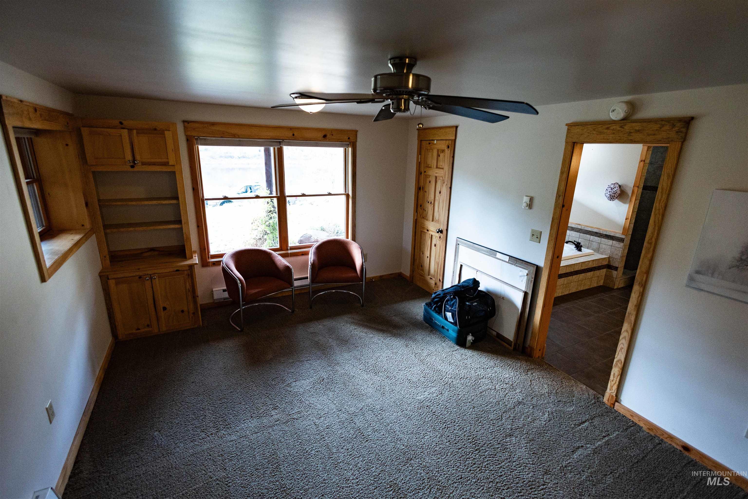4480 Highway 12 Kamiah, ID 83536 - Photo 43 of 49 Living area featuring carpet flooring and a ceiling fan
