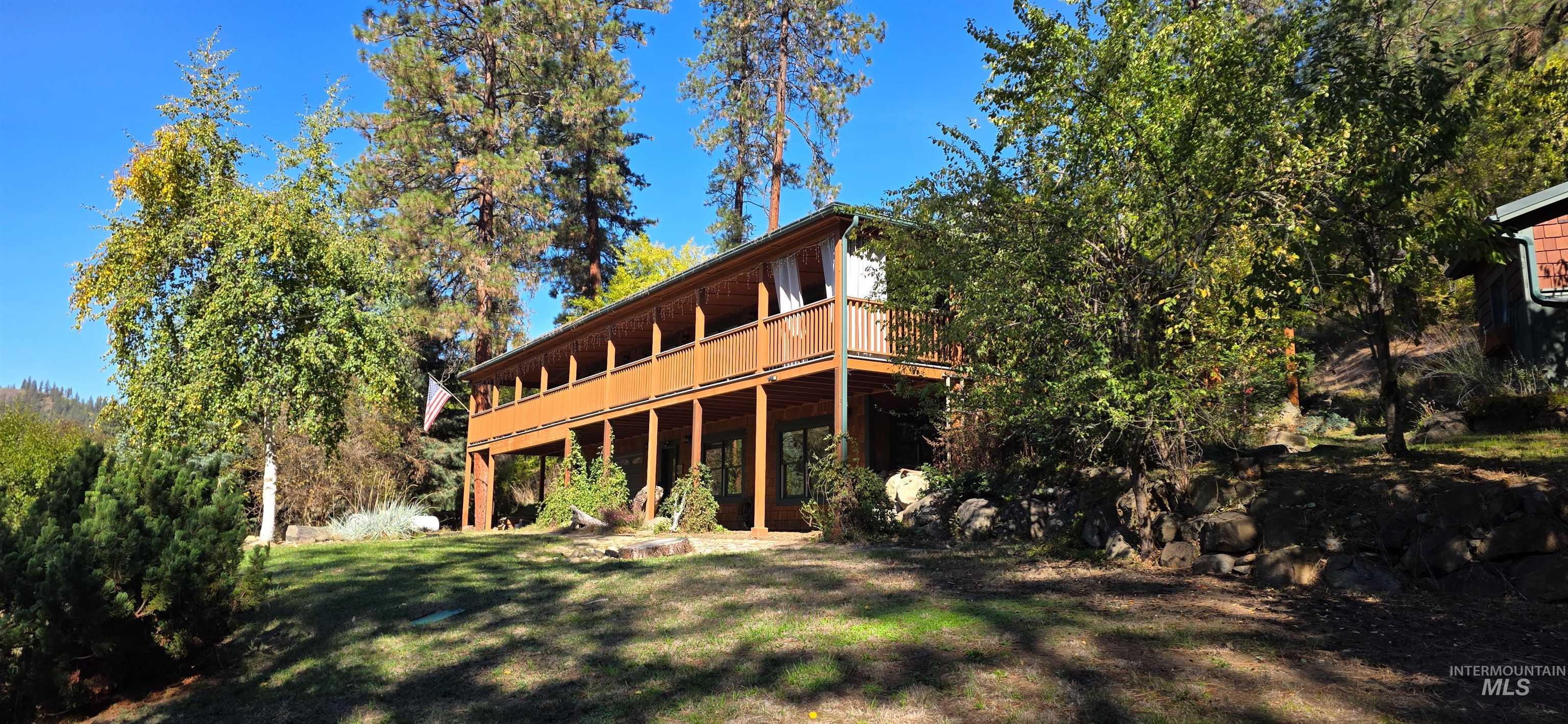 4480 Highway 12 Kamiah, ID 83536 - Photo 5 of 49 Back of house featuring a deck and a lawn