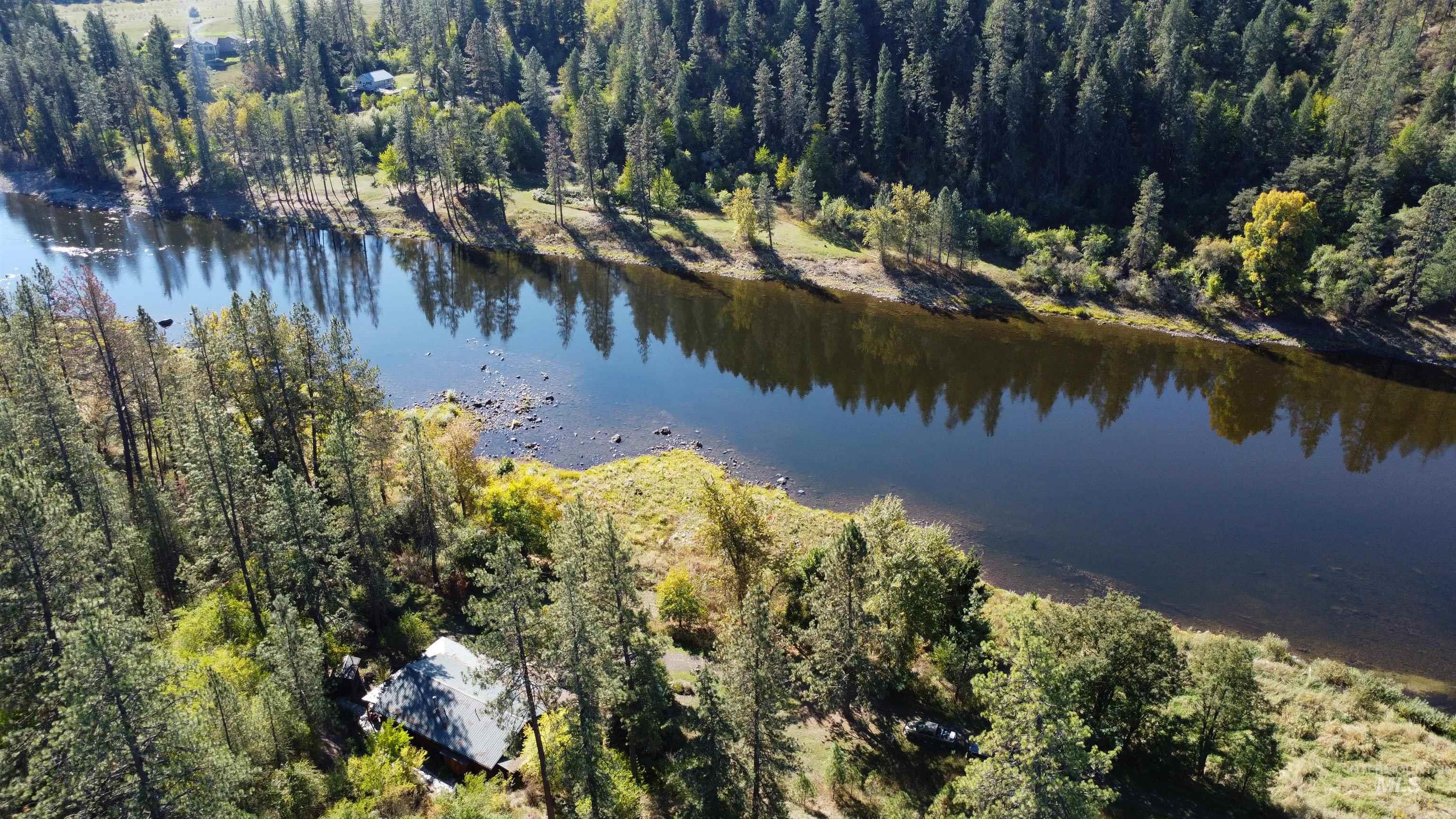 4480 Highway 12 Kamiah, ID 83536 - Photo 7 of 49 Aerial view of property and surrounding area featuring a large body of water and a forest