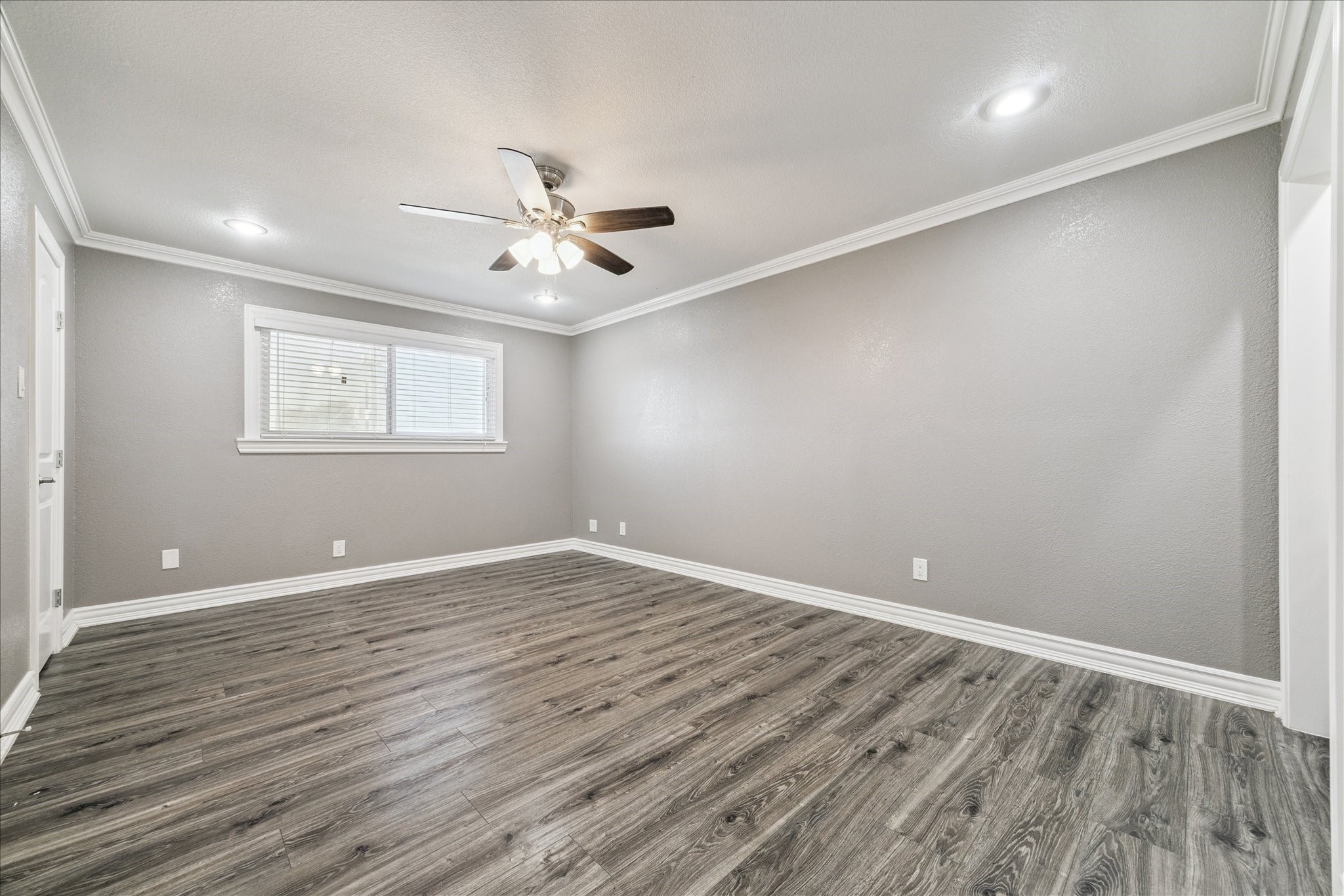 11550 Chimney Rock Road, Unit 321 Houston, TX 77035 - Photo 6 of 10 wooden floor in an empty room with a window