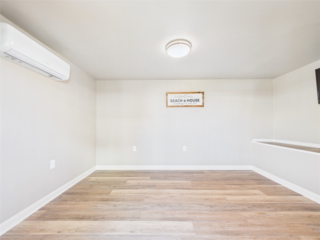 842 Main Street Crystal Beach, TX 77650 - Photo 13 of 45 a view of a room with wooden floor