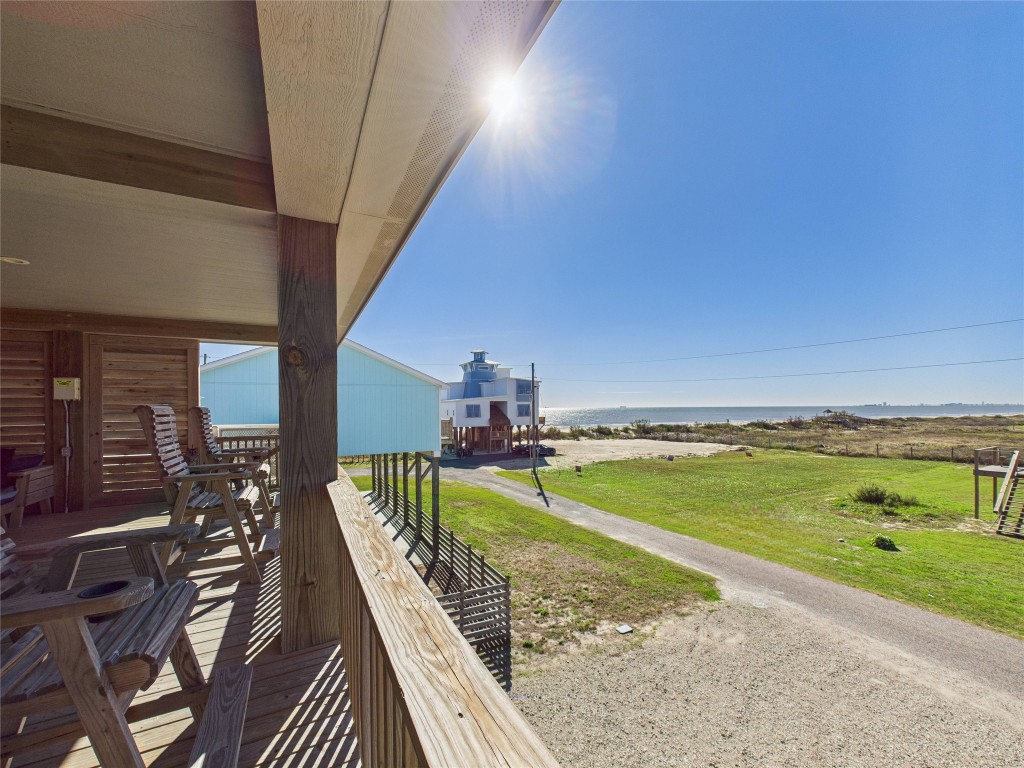 842 Main Street Crystal Beach, TX 77650 - Photo 24 of 45 a view of a swimming pool with an ocean view