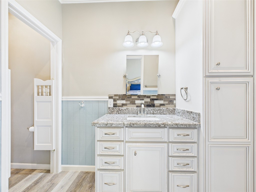 842 Main Street Crystal Beach, TX 77650 - Photo 35 of 45 a bathroom with a sink a vanity and a mirror