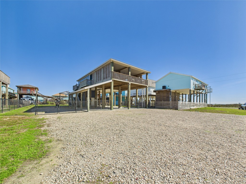 842 Main Street Crystal Beach, TX 77650 - Photo 4 of 45 a front view of a house with a yard