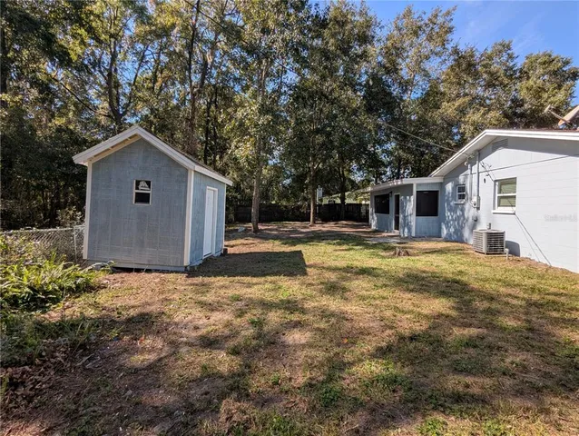 a house with trees in the background