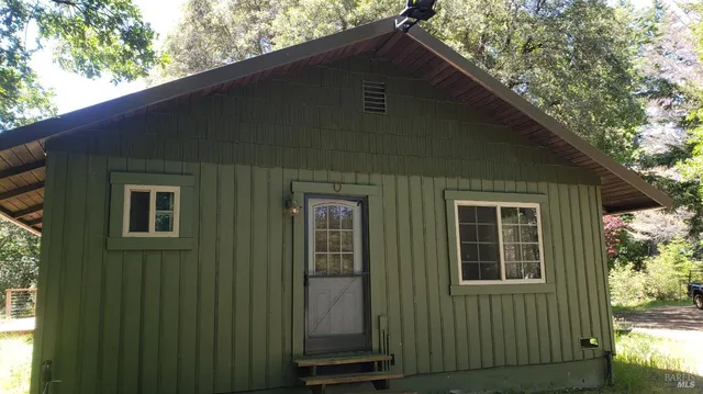 a black house with outdoor space