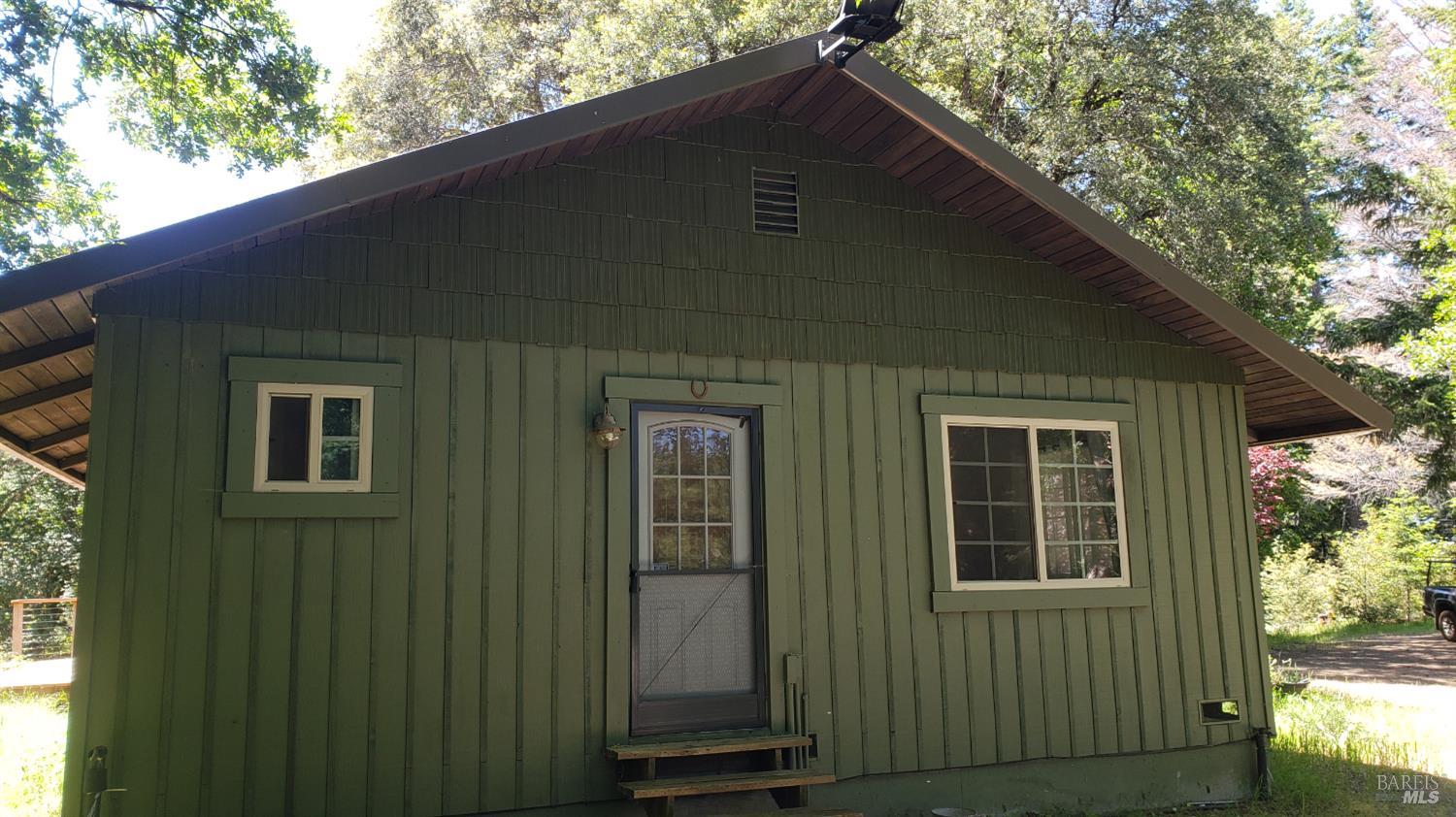 Undisclosed Address Laytonville, CA 95454 - Photo 3 of 13 a black house with outdoor space