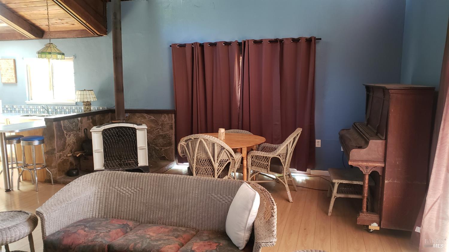 Undisclosed Address Laytonville, CA 95454 - Photo 9 of 13 a living room with furniture and a fireplace