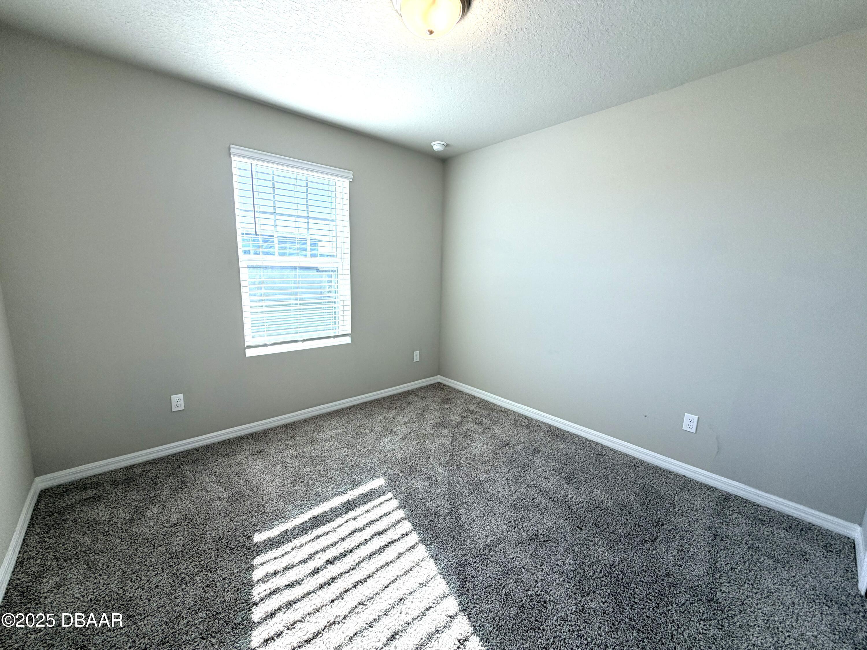30224 Armenia Road Leesburg, FL 34748 - Photo 18 of 29 an empty room with windows