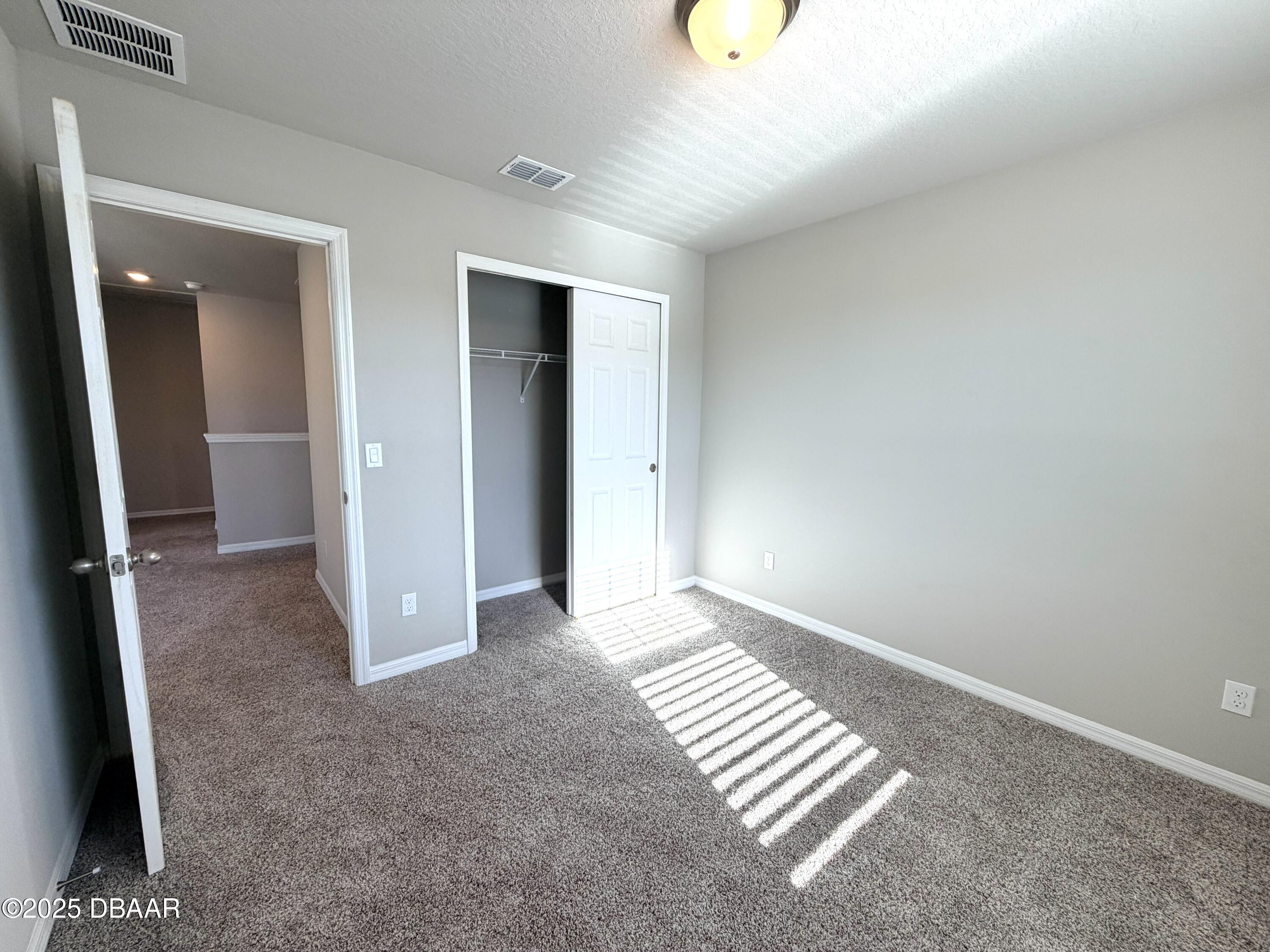 30224 Armenia Road Leesburg, FL 34748 - Photo 21 of 29 an empty room with windows