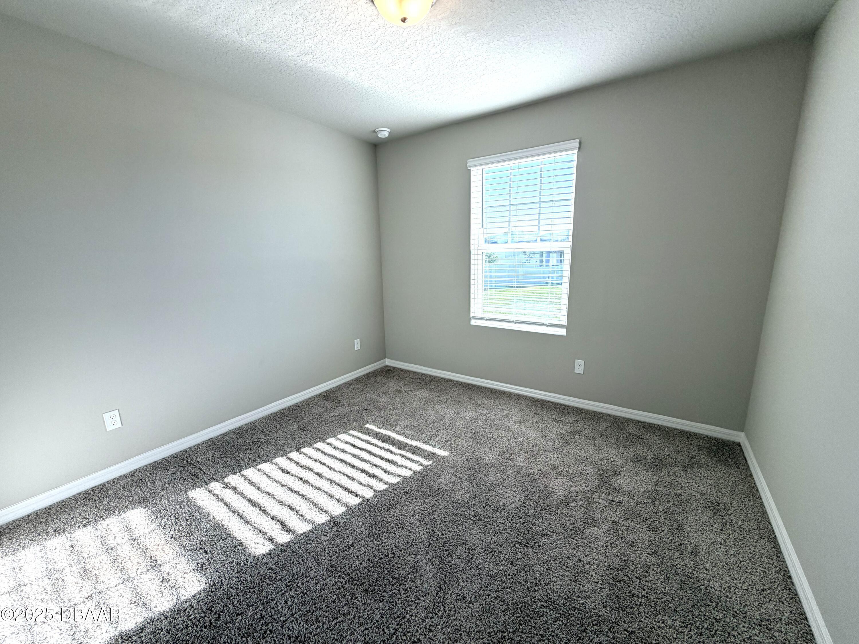 30224 Armenia Road Leesburg, FL 34748 - Photo 23 of 29 an empty room with windows