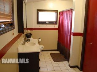 3375 South Rock City Road Ridott, IL 61067 - Photo 2 of 7 a bathroom with a sink and a mirror