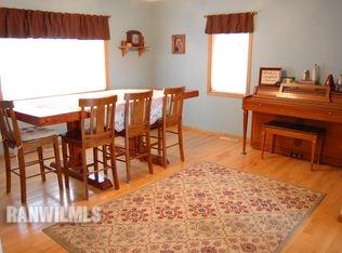 3375 South Rock City Road Ridott, IL 61067 - Photo 3 of 7 a dining room with furniture and a fireplace
