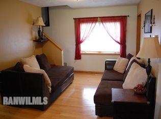 3375 South Rock City Road Ridott, IL 61067 - Photo 6 of 7 a living room with furniture and a window