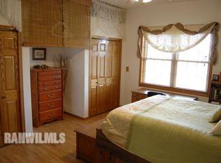 3375 South Rock City Road Ridott, IL 61067 - Photo 7 of 7 a bedroom with a bed dresser and a window