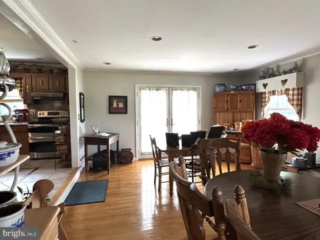 a kitchen with a stove and a table