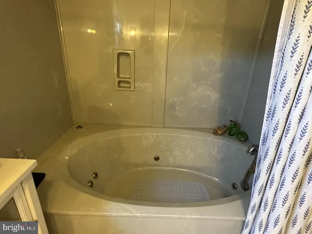a bathroom with a toilet a sink and bathtub