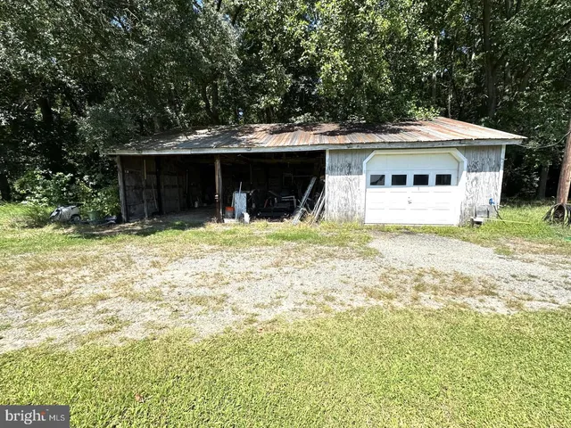 a view of a swimming pool and a yard