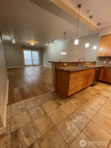 a large kitchen with lots of counter space and a window