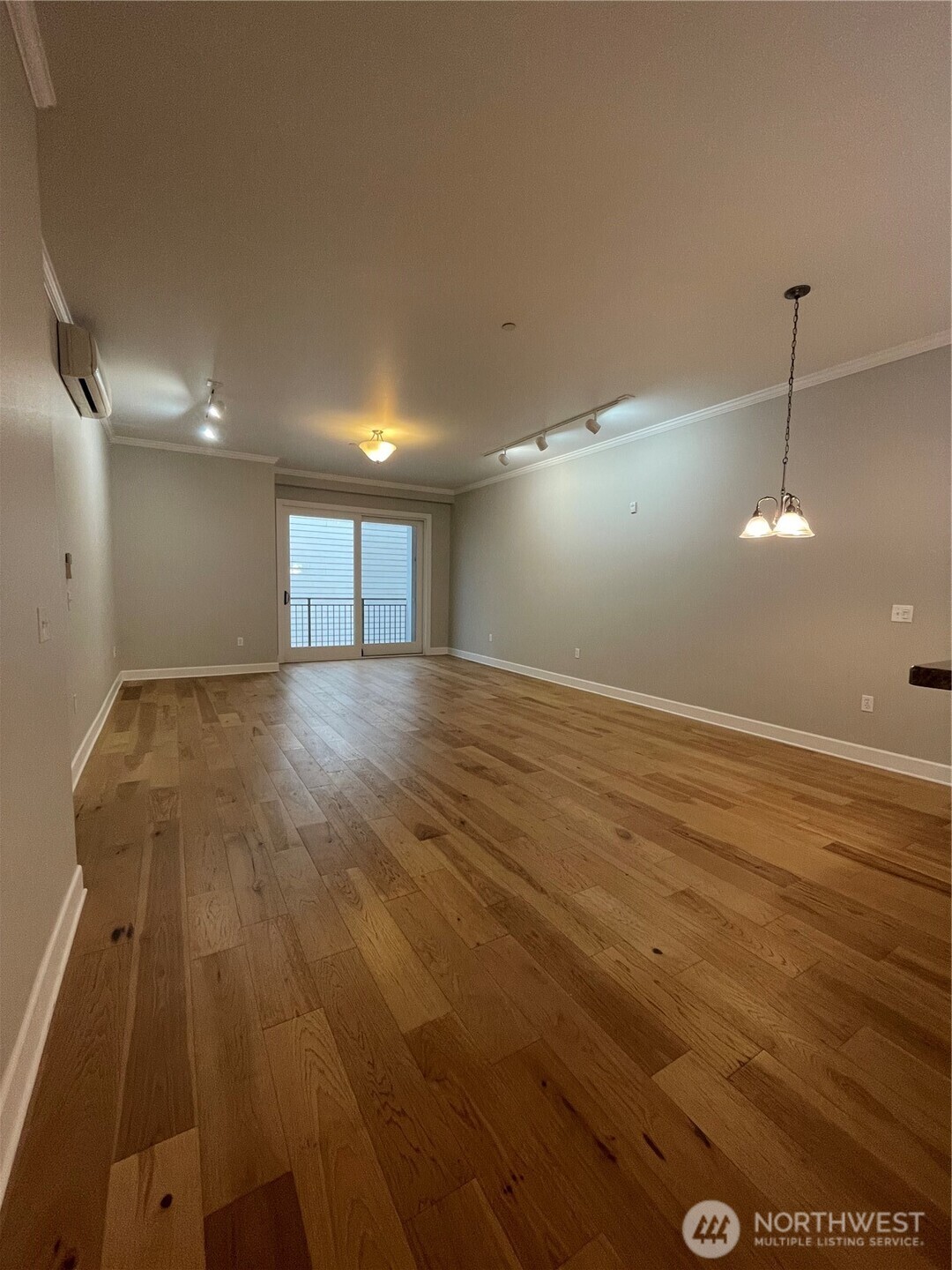 1101 McKenzie Avenue, Unit 206 Bellingham, WA 98225 - Photo 5 of 16 an empty room with wooden floor