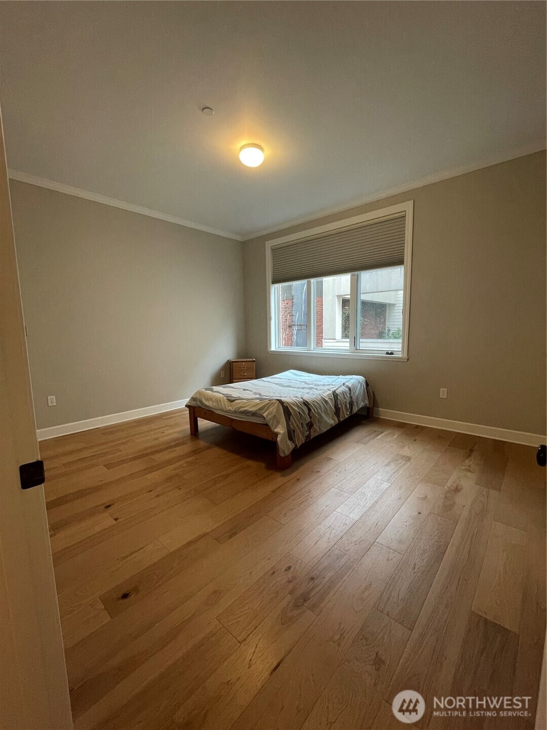 1101 McKenzie Avenue, Unit 206 Bellingham, WA 98225 - Photo 7 of 16 a spacious bedroom with a bed and a window