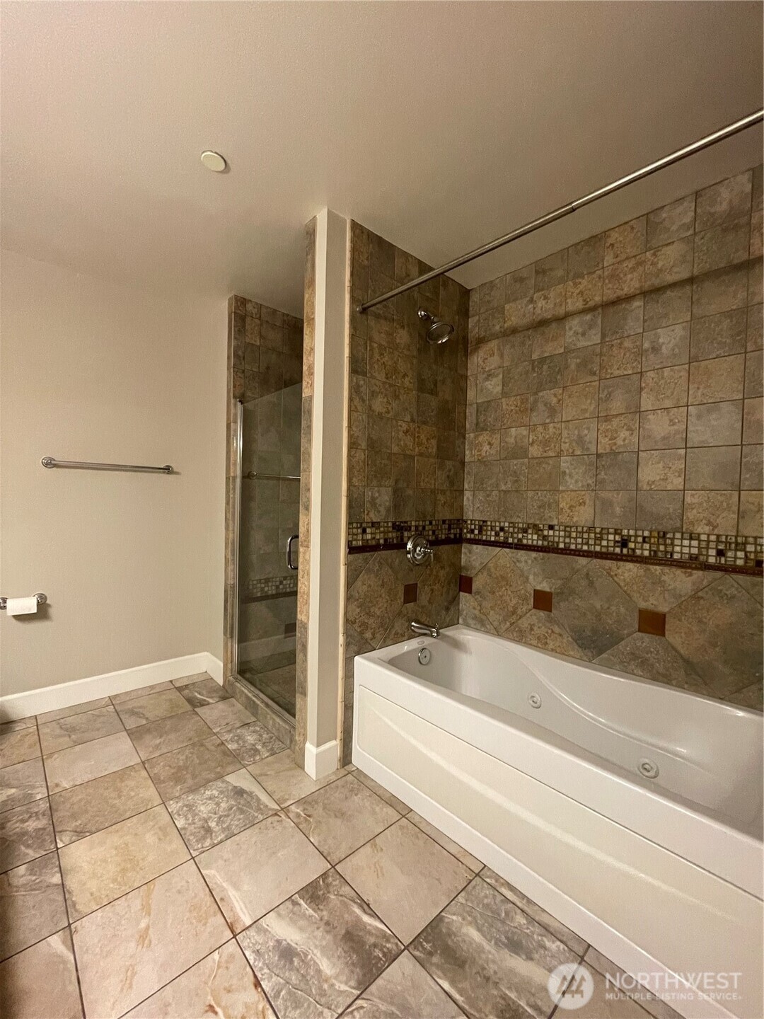 1101 McKenzie Avenue, Unit 206 Bellingham, WA 98225 - Photo 9 of 16 a bathroom with a bathtub and a shower