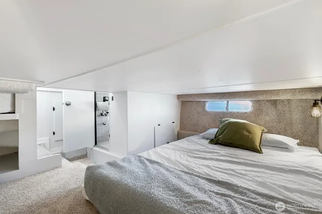 a bedroom with a bed and a walk in closet