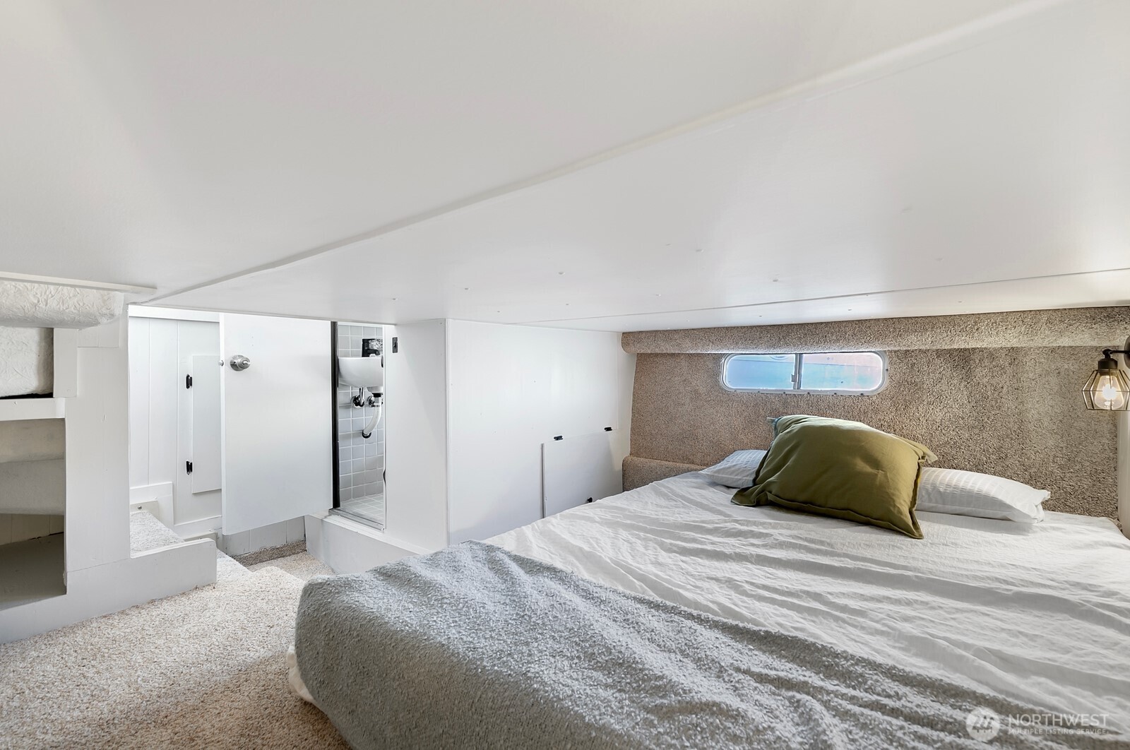 1325 Fairview Avenue North Seattle, WA 98109 - Photo 12 of 23 a bedroom with a bed and a walk in closet