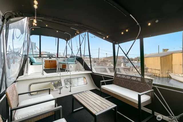 a view of a chairs and table in a balcony