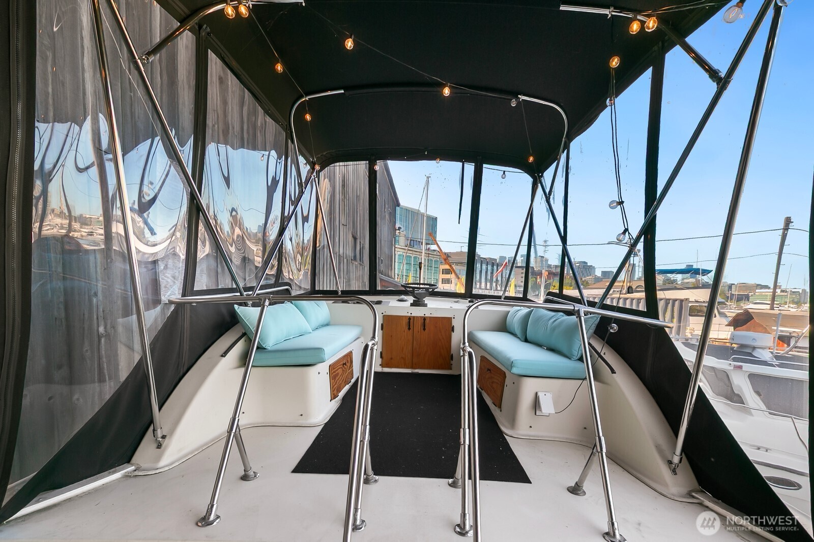 1325 Fairview Avenue North Seattle, WA 98109 - Photo 16 of 23 a dining room with furniture and a floor to ceiling window