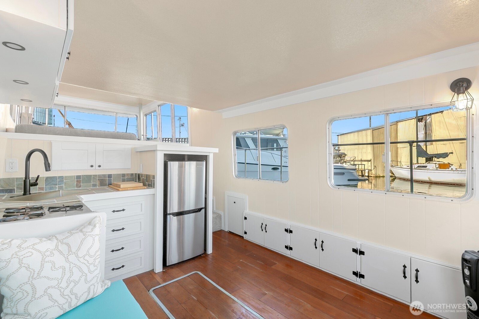 1325 Fairview Avenue North Seattle, WA 98109 - Photo 6 of 23 a kitchen with white cabinets and window