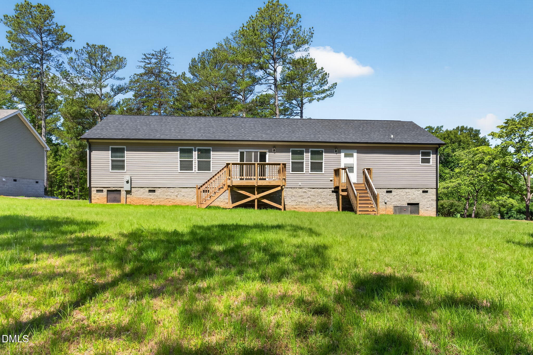 7122 Guess Road Hillsborough, NC 27278 - Photo 48 of 48 a view of a patio with table and chairs under an umbrella
