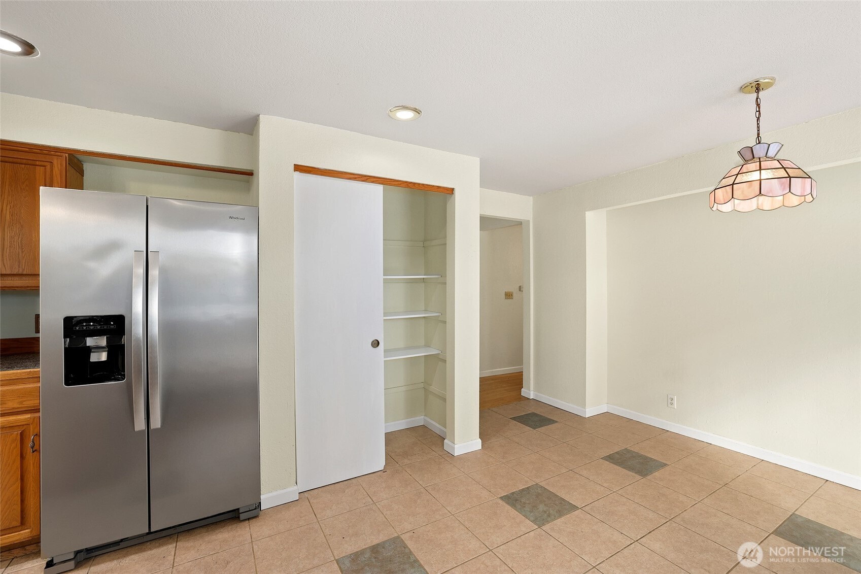 33524 33rd Place Southwest Federal Way, WA 98023 - Photo 12 of 37 a view of a refrigerator in kitchen and an empty room