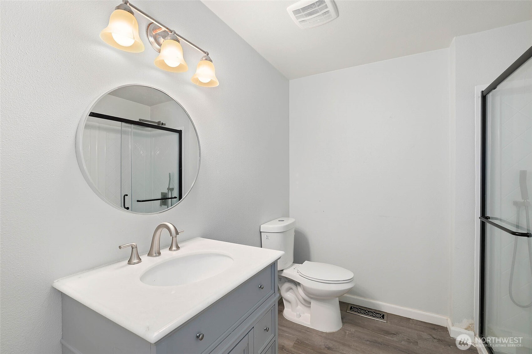33524 33rd Place Southwest Federal Way, WA 98023 - Photo 20 of 37 a bathroom with a toilet a sink and mirror