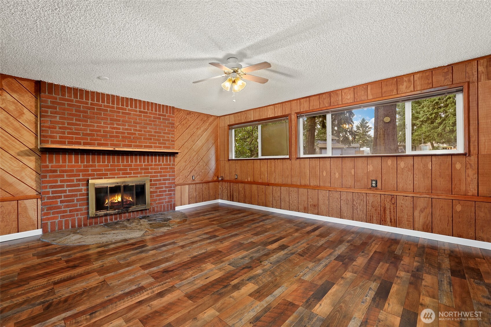 33524 33rd Place Southwest Federal Way, WA 98023 - Photo 23 of 37 a view of an empty room with a fireplace and a window