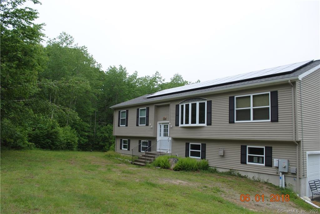 129 Walker Road Canterbury, CT 06331 - Photo 1 of 1 a house that has a lot of windows in it