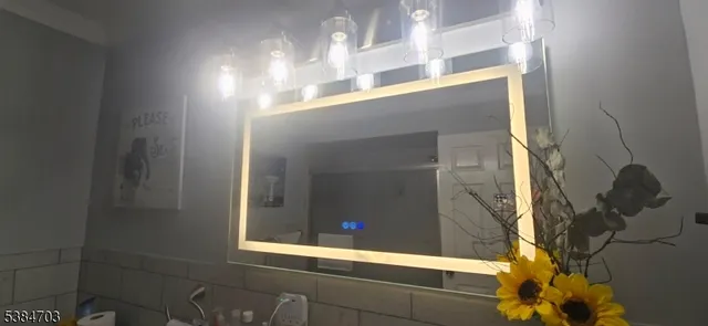 a room with a bed and a flat screen tv