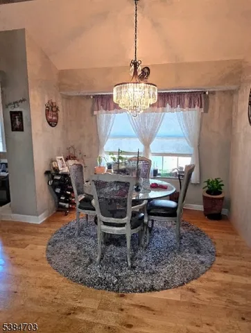 a table room with furniture and a chandelier