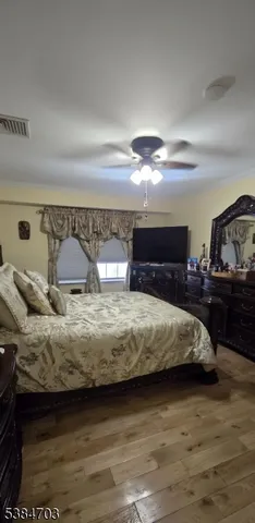 a bedroom with a bed and a view of bedroom