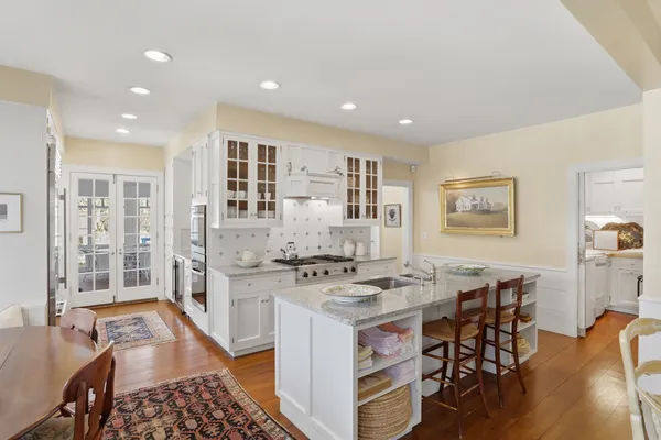a kitchen with stainless steel appliances granite countertop a stove and a refrigerator