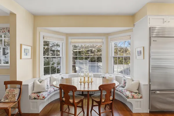 a dining room with furniture and window