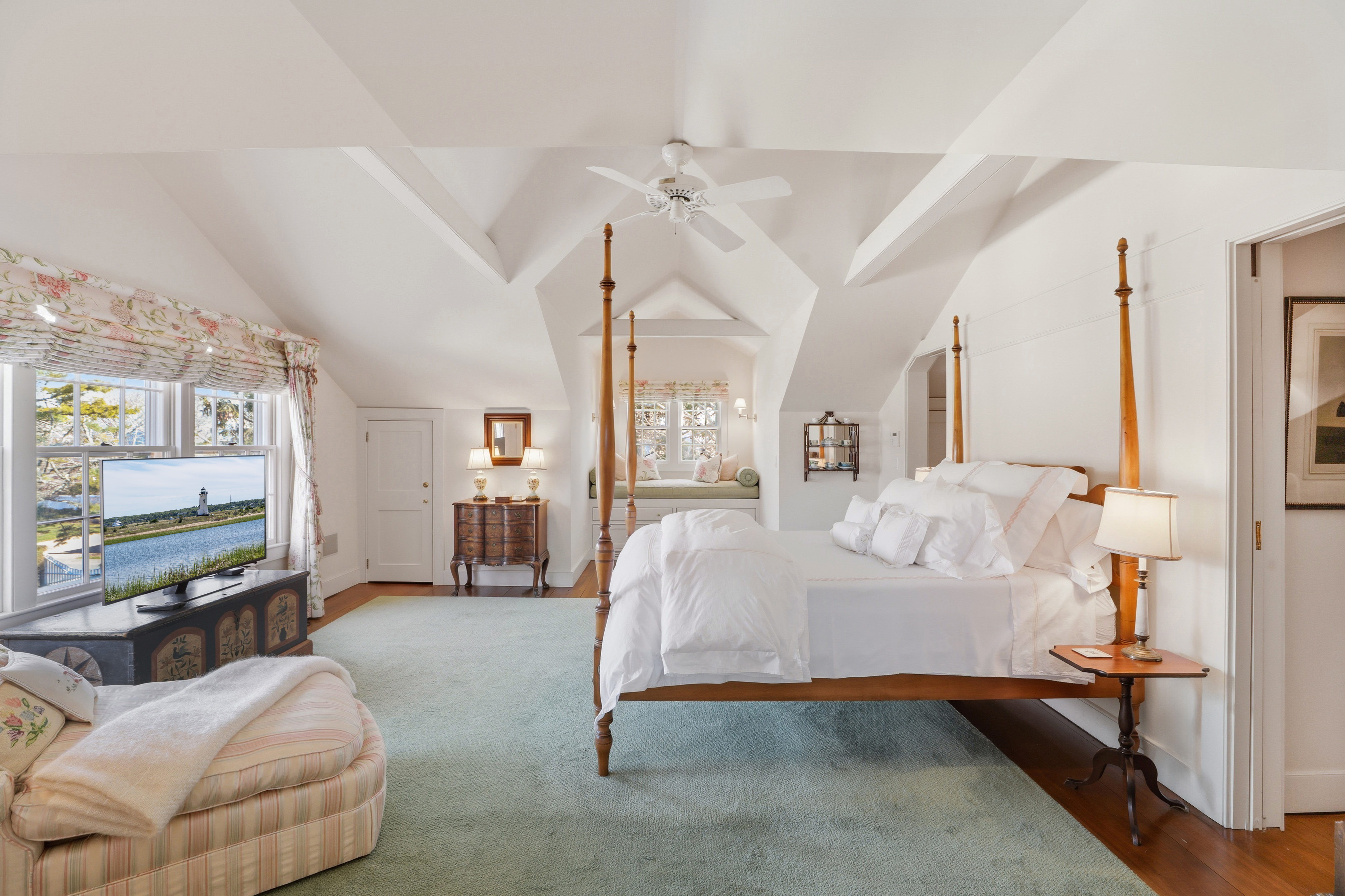 14 Thayer Street Edgartown, MA 02539 - Photo 32 of 43 a bedroom with a bed couch and a flat tv screen