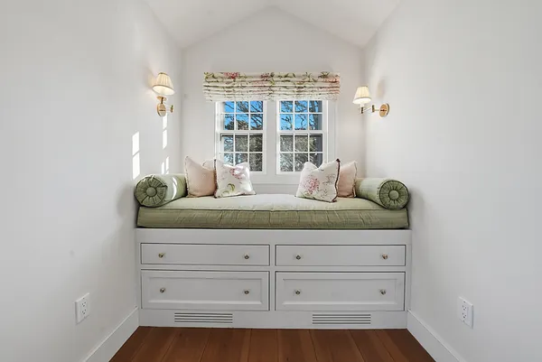 a hallway with a walk in closet