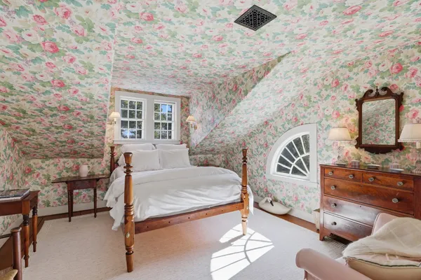 a view of a room with furniture and window