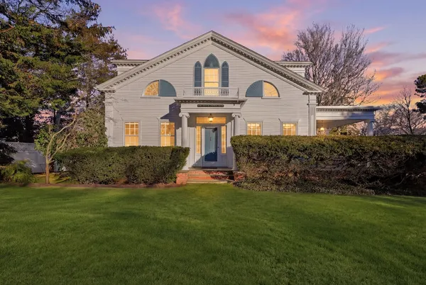 a view of yard with swimming pool and trees