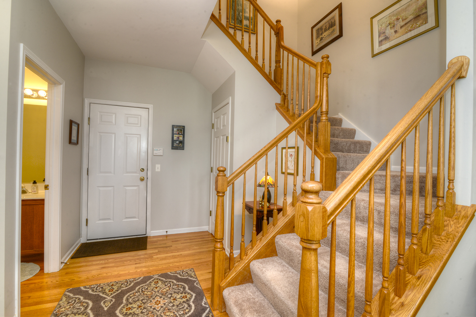 285 Ridge Road North Aurora, IL 60542 - Photo 11 of 24 a view of an entryway with wooden floor and a front door