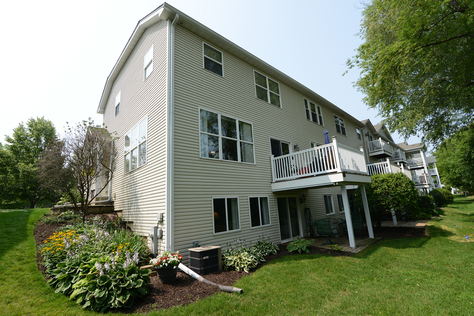 285 Ridge Road North Aurora, IL 60542 - Photo 22 of 24 a front view of a house with garden