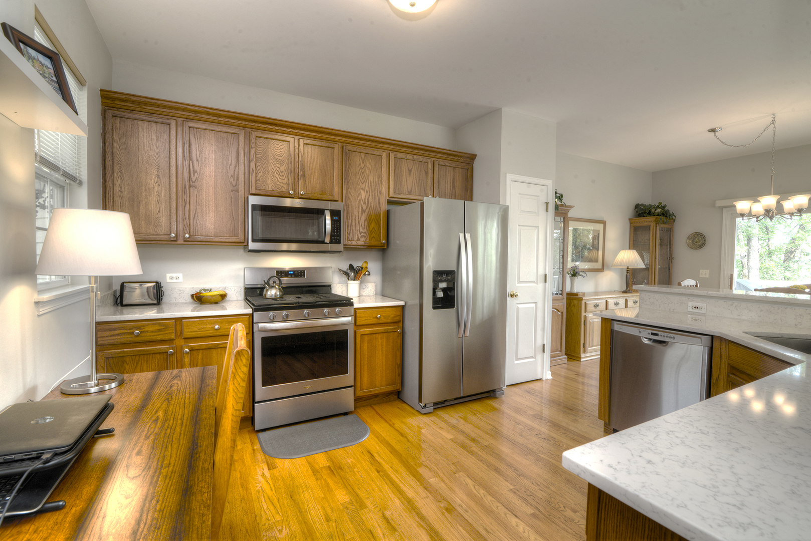 285 Ridge Road North Aurora, IL 60542 - Photo 5 of 24 a kitchen with granite countertop a refrigerator stove top oven and sink